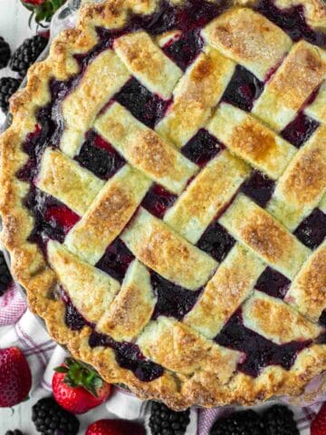 overhead shot of strawberry blackberry pie on kitchen towel
