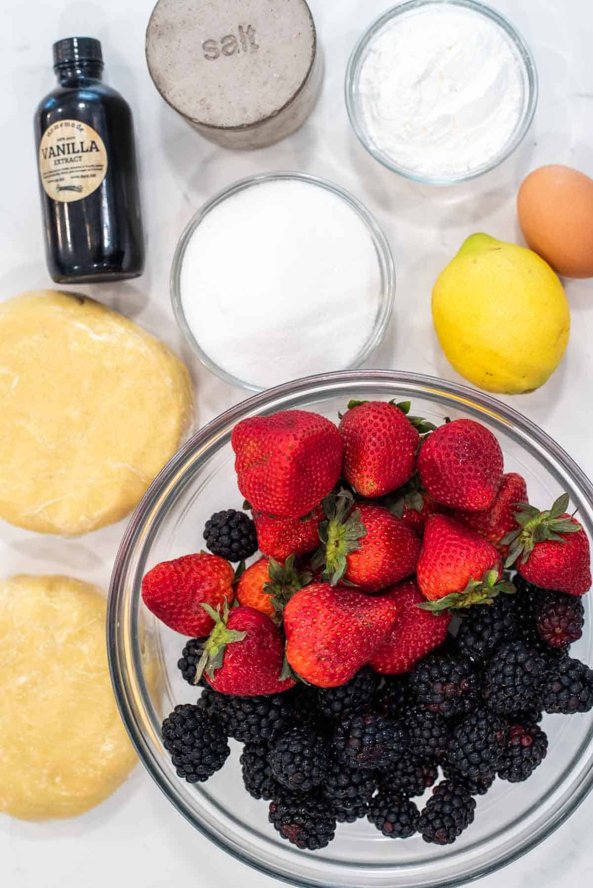 overhead shot of ingredients for strawberry blackberry pie