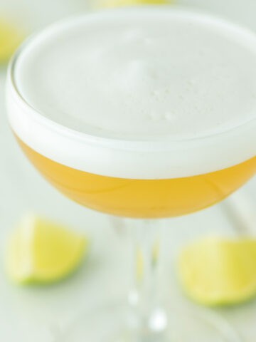 close-up of coupe glass of tequila sour